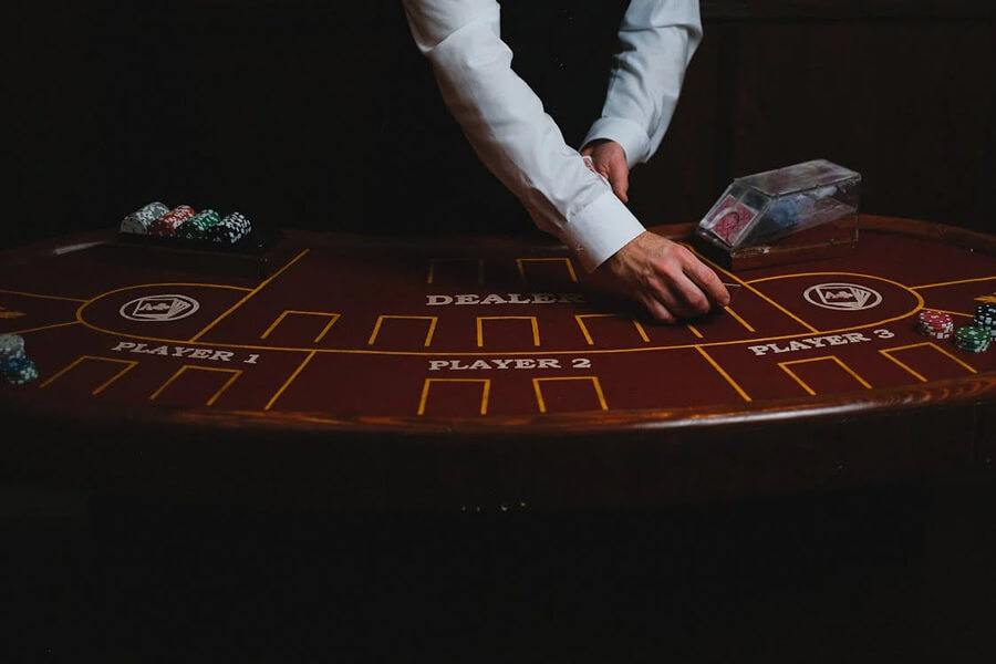 Casino Dealer Dealing Cards in Blackjack